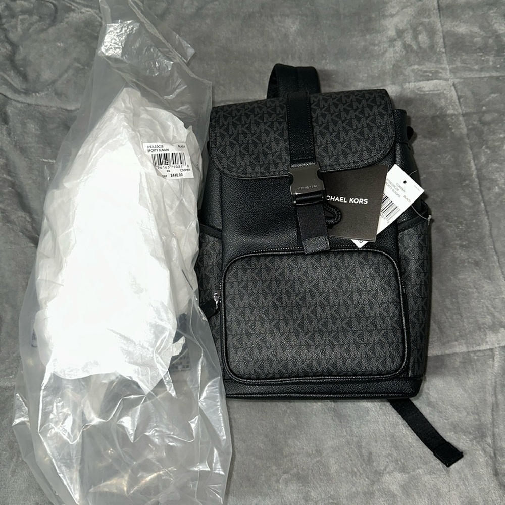 Michael Kors Cooper Sling Pack Backpack MK Black. PVC with Silver hardware.